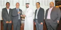  ??  ?? Mike English giving the award to Ahmed Badri, director, Eros Group. Rajat Asthana, AVP, Eros Group (second from right); Jitendra Bhavnani, marketing manager, Eros Group (extreme right) and Kamalakar Thunga, assistant marketing manager, Eros Group, are...