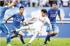  ?? — AFP photo ?? This file picture taken on March 4, 2017 shows Alexandre Pato (2nd R) of Tianjin Quanjian fighting for the ball during the Chinese Super League match against Guangzhou R&F in Guangzhou in south China’s Guangdong province.