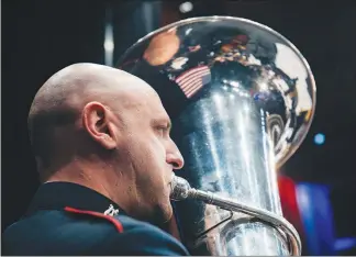  ??  ?? A member of the West Point Band plays the euphonium.