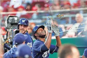  ?? DAVID KOHL / USA TODAY SPORTS ?? Lorenzo Cain is showered with confetti after hitting a two-run home run in the fifth inning.