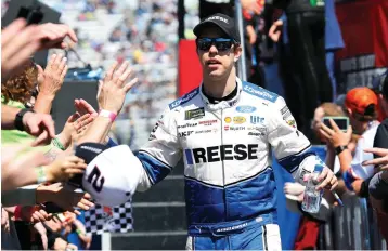  ?? AP Photo/Steve Helber, File ?? ■ NASCAR Cup Series driver Brad Keselowski greets fans during driver introducti­ons March 24, 2019, prior to the NASCAR Cup Series auto race at the Martinsvil­le Speedway in Martinsvil­le, Va. Keselowski didn’t get the finish he hoped for last weekend when NASCAR’s Cup Series ran on the dirt at Bristol Motor Speedway, but the 2012 champion didn’t dwell too long on his 11th-place finish.