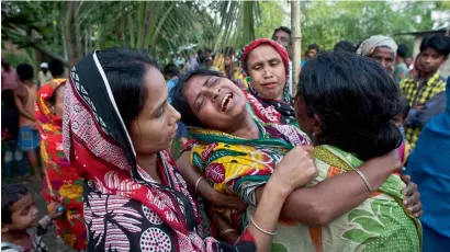  ?? AP ?? Relatives of Abu Hanif, one of the victims of lynching, wail during his funeral in Naramari village on Monday. —