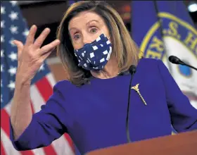  ?? Nicholas Kamm / Getty Images ?? House Speaker Nancy Pelosi, D-calif., speaks to the press Friday on Capitol Hill in Washington. Pelosi on Saturday rejected the most generous Trump administra­tion coronaviru­s aid offer to date as “one step forward, two steps back.”