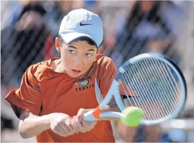  ?? JIM THOMPSON/JOURNAL ?? Eldorado’s Georgio Samaha makes a return against fellow Eagles player Mike Mounho in the final of the boys’ Class 6A singles tournament. Samaha, a freshman, prevailed for his first state title.