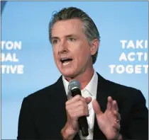  ?? JULIA NIKHINSON — ASSOCIATED PRESS ?? Gov. Gavin Newsom speaks at the Clinton Global Initiative in 2022. He signed a slew of bills recently affecting California taxpayers.