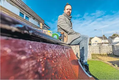  ?? Picture: Steve Brown. ?? Skateboard enthusiast Ross Salitura, 29, from Kinglassie at home with the skateboard half-pipe on which Fife Council have served enforcemen­t, to have it removed.