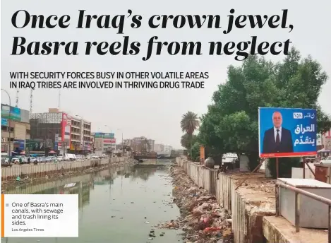  ?? Los Angeles Times ?? One of Basra’s main canals, with sewage and trash lining its sides.
