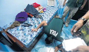  ??  ?? POLICE UNDER FIRE: The Philippine Drug Enforcemen­t Agency took over operations in the government’s war on illegal drugs.