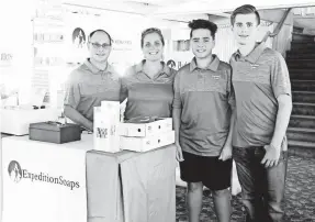  ?? PHOTOS BY TRACIE KELLY ?? The Kelly family – from left, Stephen, Tracie, Grant and Spencer – sell soap at a recent event in Lansing, Mich. Spencer, 17, who was diagnosed with Asperger’s syndrome, started the soap business in 2016.