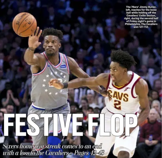  ?? THE ASSOCIATED PRESS ?? The 76ers’ Jimmy Butler, left, reaches for the loose ball while holding off the Cavaliers’ Collin Sexton, right, during the second half of Friday night’s game in Philadelph­ia. The Cavaliers won 121-112.