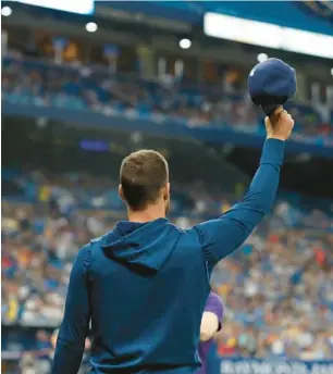  ?? SCOTT AUDETTE/AP ?? Kevin Kiermaier salutes the crowd at Tropicana Field after the team, knowing its clubhouse leader wouldn’t be returning this season, ran a video tribute Sept. 24.