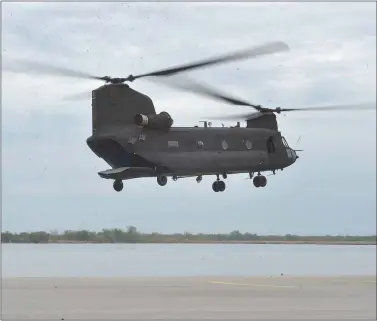  ?? PETE BANNAN - MEDIANEWS GROUP ?? The first Chinook Block II aircraft performs in-flight maneuvers behind the Ridley Township plant in this 2019photo. It was the first Block II Chinook off the line and was under going testing. The rear deck lowers for loading.