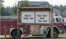  ??  ?? The message board outside the volunteer fire department in Horsefly on Monday. Supplies in the community of 800 are running low.