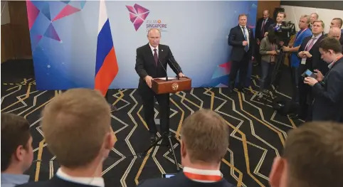  ?? (Reuters) ?? RUSSIA’S PRESIDENT Putin attends a news conference on the sidelines of the East Asia Summit in Singapore.