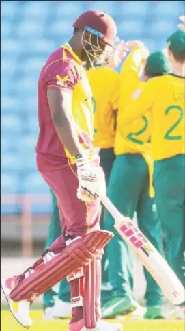  ??  ?? All-rounder Andre Russell trudges off after being dismissed first ball in the fifth T20 Internatio­nal yesterday.