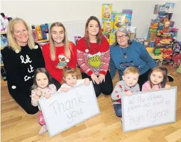  ??  ?? All smiles Kind-hearted staff and children from High Flyers Nursery in Cambuslang are helping others