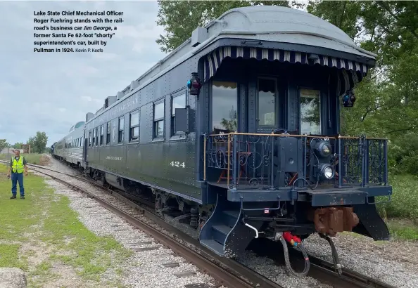  ?? Kevin P. Keefe ?? Lake State Chief Mechanical Officer Roger Fuehring stands with the railroad’s business car Jim George, a former Santa Fe 62-foot “shorty” superinten­dent’s car, built by Pullman in 1924.