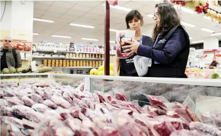  ??  ?? Members of the Public Health Surveillan­ce Agency (PHSA) collect meats to analyse in their laboratory, at a supermarke­t in Rio de Janeiro, Brazil. (Reuters)