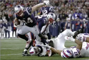  ?? STEVEN SENNE - THE ASSOCIATED PRESS ?? New England Patriots running back Rex Burkhead breaks loose from an attempted tackle to run for a touchdown against the Buffalo Bills in the second half of an NFL football game, Saturday, Dec. 21, 2019, in Foxborough, Mass.