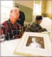  ?? Dwayne Newton Associated Press A HEAVEN’S GATE ?? member at a 1997 informatio­nal meeting. The cult, and QAnon, have brandished religious images.