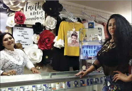  ?? PHOTO TOM BODUS ?? Brawley Fashions store owner Annie Vijarro (right) with her employee, Jessy Herrera, on the shop’s opening day. The store is the second business Vijarro has opened this year. The other is a cosmetics store a few doors down.
