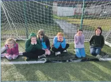  ?? ?? These youngsters are just some of the many users fed up with the bad state of the pitch at Tobermory; and right, the hole is getting bigger the longer it is left, and is a danger to the many children and others who use the pitch.