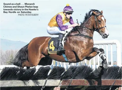  ?? PHOTO: PETER RUBERY ?? Sound as a bell . . . Monarch Chimes and Shaun Phelan leap towards victory in the Hawke’s Bay Hurdle on Saturday.