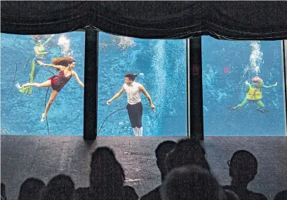  ?? PATRICK CONNOLLY PHOTOS TRIBUNE NEWS SERVICE ?? Mermaids perform in the underwater attraction, The Little Mermaid, at Weeki Wachee Springs State Park.