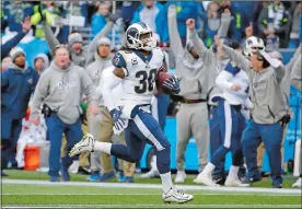  ?? ELAINE THOMPSON/AP PHOTO ?? The Rams bench reacts as running back Todd Gurley runs for his third touchdown of Sunday’s game against the Seahawks at Seattle. Gurley also caught a touchdown pass and the Rams won 42-7.