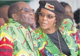  ?? Tsvangiray­i Mukwazhi Associated Press ?? GRACE MUGABE with her husband, Robert Mugabe, Zimbabwe’s leader since 1980 whom she hopes to succeed. Supporters admire her staunch loyalty to him.