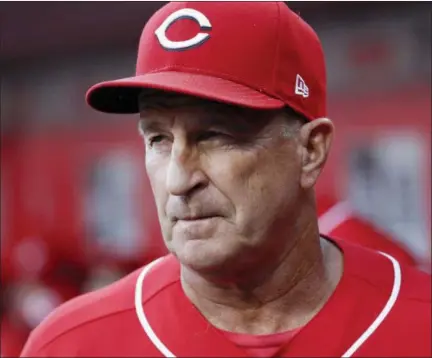  ?? JOHN MINCHILLO - THE ASSOCIATED PRESS ?? FILE - In this Sept. 29, 2018file photo Cincinnati Reds interim manager Jim Riggleman works in the dugout in the eighth inning of a baseball game against the Pittsburgh Pirates in Cincinnati. Riggleman has been hired by the New York Mets as bench coach for Mickey Callaway. He replaces Gary DiSarcina, who is shifting to third base coach. New York, which announced the hiring Monday, Nov. 26, 2018 went 77-85in Callaway’s first season as a manager, and Callaway drew attention for game management.