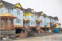  ?? RENÉ JOHNSTON TORONTO STAR FILE PHOTO ?? Housing starts and completion­s have peaked in areas roughly 30 kilometres outside Toronto’s city centre, the Canada Mortgage and Housing Corp. said in two new reports.