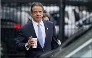  ?? SETH WENIG—ASSOCIATED PRESS ?? New York Gov. Andrew Cuomo prepares to board a helicopter after announcing his resignatio­n, Tuesday, Aug. 10, 2021, in New York. Cuomo will resign in disgrace this week. His departure comes after a state investigat­ion found he sexually harassed 11women. It’s a stunning reversal for a powerful politician who not that long ago was considered a possible contender for the White House. Observers and people who know Cuomo say his drive to dominate made him an effective governor. He passed landmark legislatio­n and built new train stations, airports and bridges. But his accusers say the same habits also made him a bully who used his power to get what he wanted. They say he thought he could intimidate them into silence.