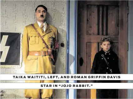  ?? Fox Searchligh­t Pictures ?? TAIKA WAITITI, LEFT, AND ROMAN GRIFFIN DAVIS STAR IN “JOJO RABBIT.”