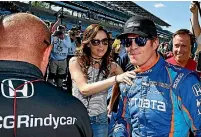  ?? PHOTO: PHOTOSPORT ?? ‘‘It will make you feel really small again,’’ said Scott Dixon, right, of being robbed at gunpoint hours after securing pole position for the Indianapol­is 500.