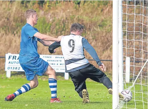  ??  ?? The referee deemed this Musselburg­h effort had crossed the line and awarded a goal to give the visitors a 2-0 lead against Downfield. Home keeper Darren Clarkson was sent off for protesting. The Spiders lost 3-1.