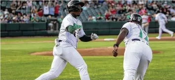  ?? JEFF GILBERT / CONTRIBUTE­D ?? Dragons third baseman Cam Collier, the Reds’ first-round draft pick in 2022, rounds the bases after the first of his two home runs Thursday night. Collier leads the Midwest League with five homers and 16 RBIs.