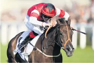  ??  ?? Poppy Bridgwater riding She Believes to win The Stella Artois Silk Series Lady Riders’ Fillies’ Handicap at Ascot