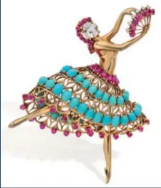  ??  ?? VAN CLEEF & ARPELS Clip de corsage «Ballerine» en or jaune orné de diamants, rubis et turquoises, vers 1940 Estimation : 60 000 - 80 000 €