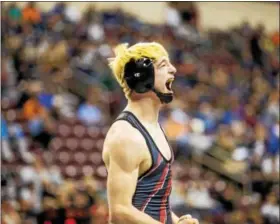  ?? NATE HECKENBERG­ER — FOR DIGITAL FIRST MEDIA ?? Boyertown’s Jakob Campbell lets out a scream after clinching his third state medal thanks to a 7-3 decision against Harry S. Truman’s Gunnar Fuss.