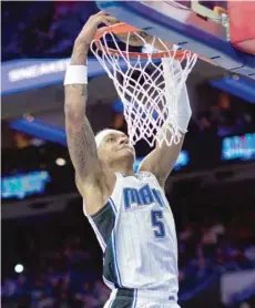  ?? — USA Today Sports ?? Orlando Magic’s Paolo Banchero (5) dunks the ball against the Philadelph­ia 76ers during the second quarter at Wells Fargo Center.