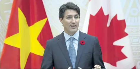  ?? ADRIAN WYLD/THE CANADIAN PRESS ?? Prime Minister Justin Trudeau responds to a question during a joint media availabili­ty with Vietnamese Prime Minister Nguyen Xuan Phuc (not shown) in Hanoi, Vietnam, on Wednesday.
