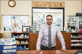  ?? ALLEN EYESTONE / THE PALM BEACH POST ?? Thomas Rebhandl runs City Center Pharmacy in a 76-year-old building that occupies a busy spot across from West Palm’s library and City Hall.
