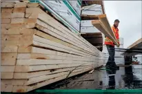  ?? CP FILE PHOTO ?? Doug Howson loads lumber onto a forklift at Haney Builders Supplies, in Maple Ridge, B.C., on June 12, 2020.