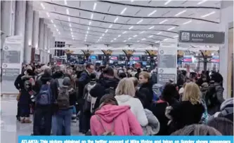  ??  ?? ATLANTA: This picture obtained on the twitter account of Mike Vizdos and taken on Sunday shows passengers waiting in the terminal of the Atlanta Hartsfield-Jackson airport in Atlanta, Georgia. — AFP