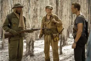  ?? VINCE VALITUTTI/WARNER BROS. ?? Samuel L. Jackson, left, John C. Reilly and Tom Hiddleston appear in Kong: Skull Island.