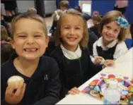  ?? PHOTO COURTESY OF THE WYNDCROFT SCHOOL ?? Students were all smiles earlier this month as they enjoyed cake and other treats in celebratio­n of The Wyndcroft School’s 100th academic year.
