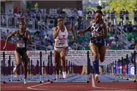  ?? ASHLEY LANDIS — THE ASSOCIATED PRESS ?? Anna Cockrell, right, wins the fourth heat of the women’s 100-meter hurdles June 19at the U.S. Olympic Track and Field Trials in Eugene, Ore.