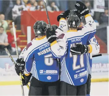  ??  ?? Ben Russell celebrates scoring the winner against Basingstok­e.