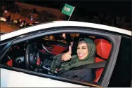  ?? HAMAD I MOHAMMED / REUTERS ?? A Saudi woman celebrates as she drives her car in her neighborho­od in Al Khobar, Saudi Arabia, on Sunday.